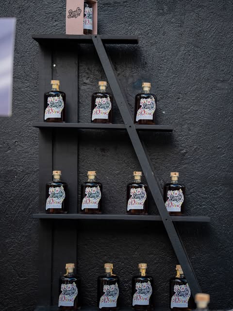 Banoffee bottles displayed on a black shelf